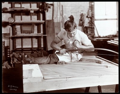 A Man Working in the Hartman Piano Co. Factory, 1907 by Byron Company