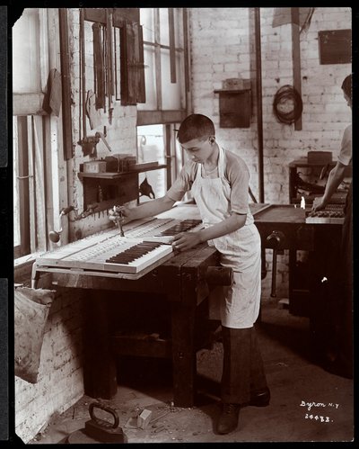 A Young Man Working in the Harrington Piano Co. Factory, 1907 by Byron Company