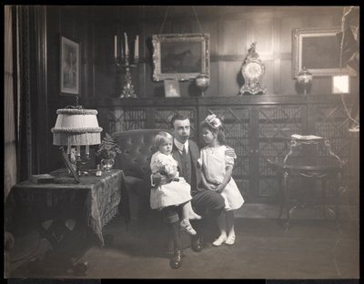 Clarence Mackay with his children in the library of Harbor Hill, in Roslyn, Long Island by Byron Company