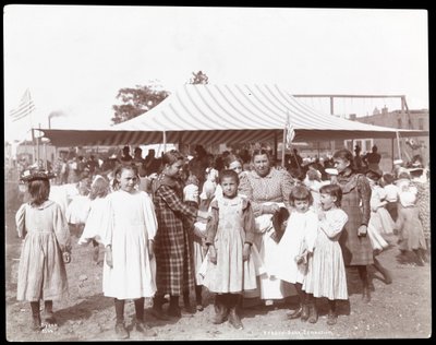 Group of girls and a woman at the Hudson Bank Gymnasium and Playground, 53rd Street and 11th Avenue, New York, 1898 by Byron Company