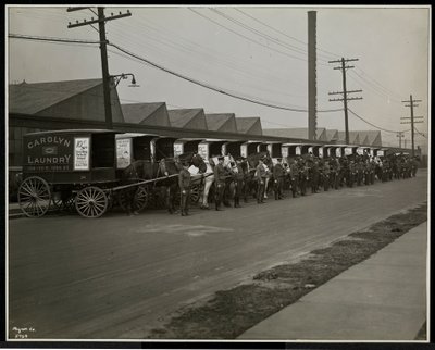 Horsedrawn Delivery Wagons Parked Outside the Carolyn Laundry at 111 East 128th Street, East Harlem, New York, 1929 by Byron Company