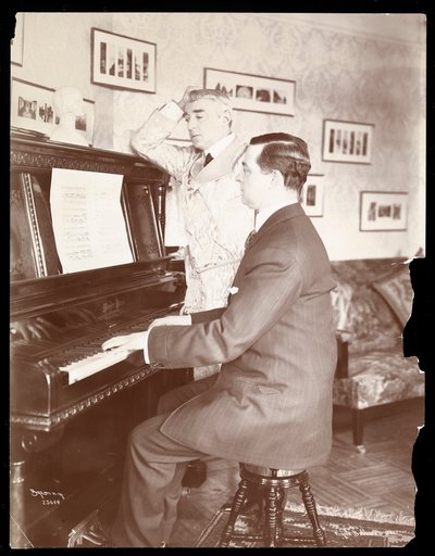 Kyrle Bellew and friend at the piano in Bellew