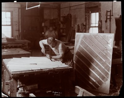 Man Working in the Hardman, Peck and Co. Piano Factory by Byron Company