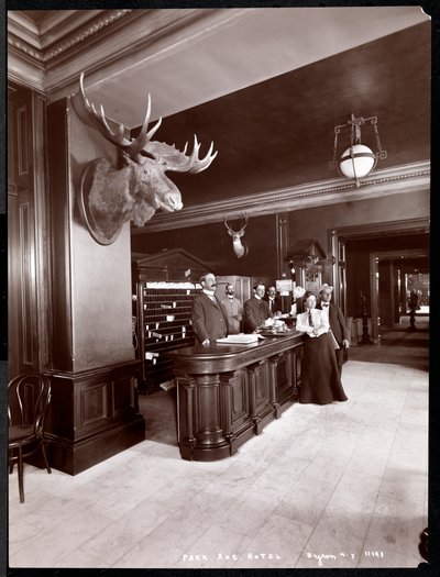 The lobby and registration desk at the Park Avenue Hotel, 1901 or 1902 by Byron Company
