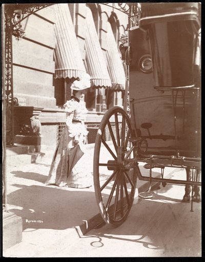 Woman approaching a carriage at the Waldorf Astoria Hotel, 34th Street and 5th Avenue, New York, 1897 or 1898 by Byron Company