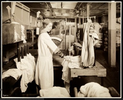 Women tagging bags of laundry at the Carolyn Laundry, East Harlem, New York, 1928 by Byron Company