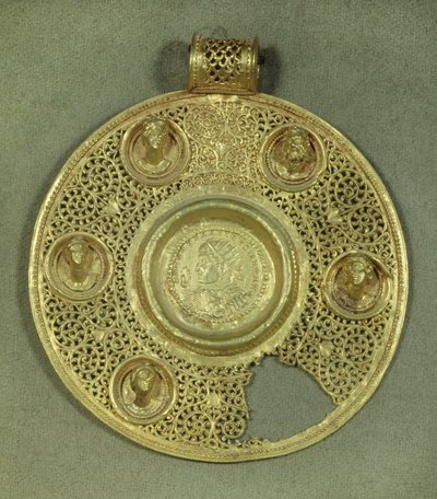 Gold circular medallion: solidus of Constantine I the Great (270-337 AD) struck at Sirmium in 321 AD, in an opus interrasile frame, adorned with 5 relief busts. 4th century AD. Paris, Musee du Louvre by Byzantine
