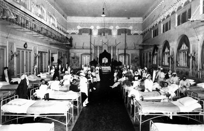 Decorated Salon at a Hospital with War Wounded and Red Cross Nurses by Carlo Wulz