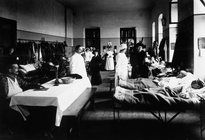 Decorated Salon at a Hospital with War Wounded, Doctors, Red Cross Nurses and Visitors by Carlo Wulz