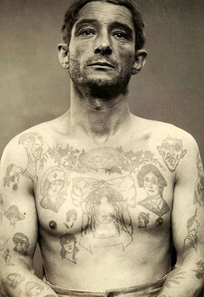 Portrait of a tattooed man by Charles Eisenmann
