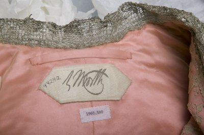 Charles Frederick Worth maker label from inside evening coat belonging to Bertha Palmer, c.1902. Worth, Paris. by Charles Frederick Worth