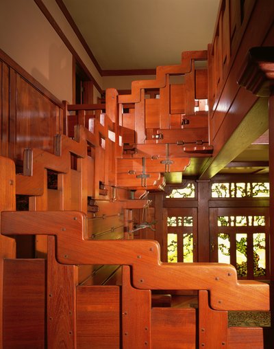 View of the Hand Railing of the Main Staircase with the Front Entryway in the Background by Charles & Henry (1870 1954) Greene