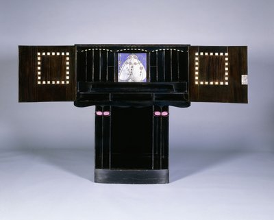 A writing cabinet designed for Walter W. Blackie Esq., Hill House, Edinburgh by Charles Rennie Mackintosh