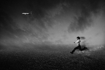 Boy Chasing Plane by Che Abu Bakar