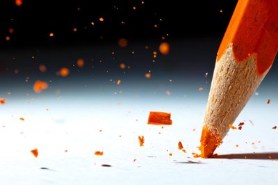 Orange Pencil Breaking by Christophe Kiciak