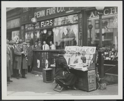 Blind news dealer, Fannie Lyons, at her stand at the southeast corner of 7th Avenue & 34th Street by Company Byron
