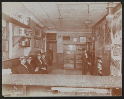 Empire Film Co (Possibly at Broadway and 55th Street) with Movie Posters on Wall and Customers Waiting by Company Byron