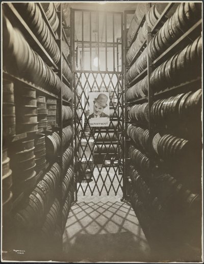 Film storage room at the Mutual Film Co. with poster of Charlie Chaplin, New York by Company Byron