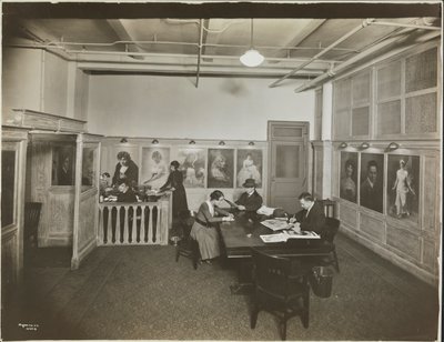 Main Office/Reception Room at the Mutual Film Co with Secretary at Desk, People at a Table Reading, and Portraits on Wall, New York by Company Byron
