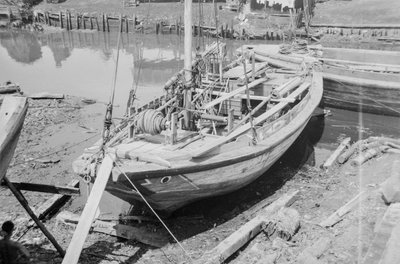 A Twaqo type junk dried out on shore at Singapore by David Watkin Waters
