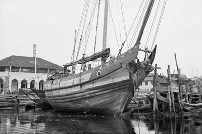 A peaked stern Twaqo type junk berthed at Singapore by David Watkin Waters