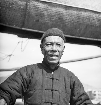 A Portrait of One of the Crew of a Canton Salt Junk on Board His Vessel at Sham Shui Po, Hong Kong by David Watkin Waters