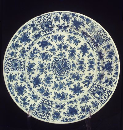 Plate with blue rose pattern by Dutch School