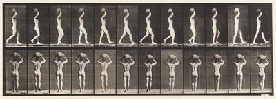 Walking, Carrying 70 lb. Stone on Head, Hands Raised by Eadweard Muybridge