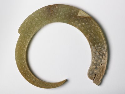 Pendant in the Form of a Curling Dragon by Eastern Zhou Dynasty Chinese School