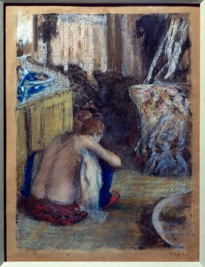 Woman squatting by Edgar Degas