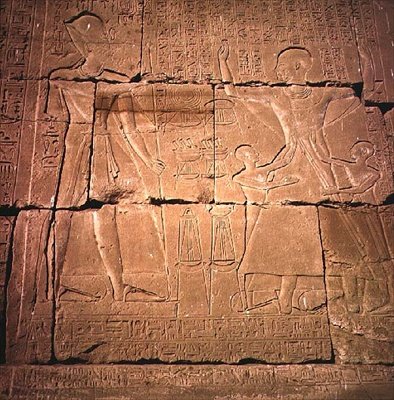 Relief depicting a pharaoh and his family by Egyptian
