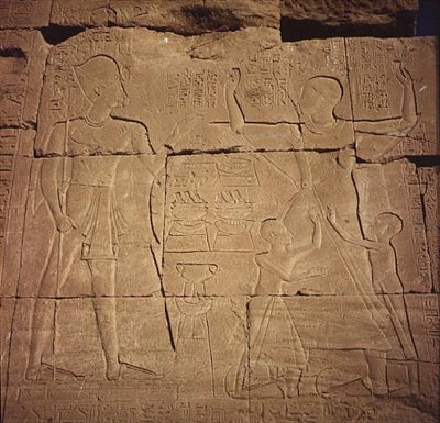 Relief depicting a pharaoh and his family by Egyptian