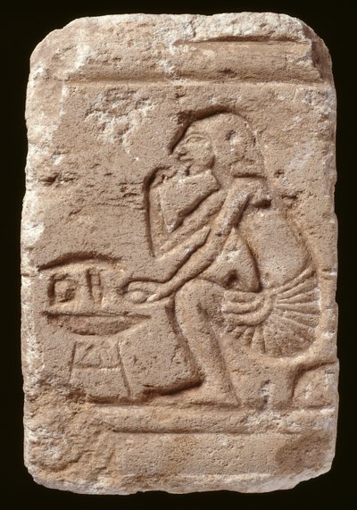 Relief of a man seated beside a table, Amarna Period by Egyptian