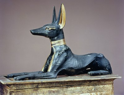 Anubis, Egyptian god of the dead from a chest in the form of a shrine, from the tomb of Tutankhamun by Egyptian 18th Dynasty