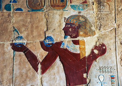 Painted relief of Thutmose offering wine to Sokaris, Mortuary Temple of Hatshepsut, Deir el-Bahari, Luxor, Thebes (Unesco World Heritage List) by Egyptian 18th Dynasty