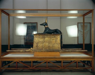 Treasure of Tutankhamen, wooden statue of jackal god Anubis upon a gilded chest by Egyptian 18th Dynasty