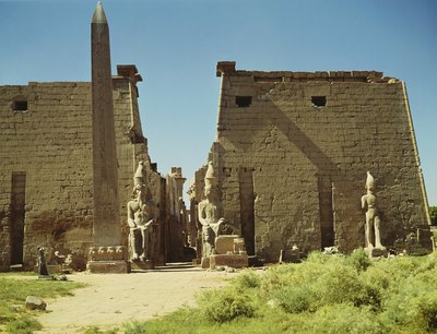 Facade and First Pylon with two seated statues of Ramesses II and the remaining obelisk by Egyptian 19th Dynasty