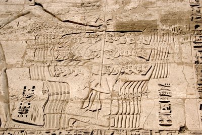 Detail of the reliefs of the first pylon representing the capture of fighters belonging to the peoples of the sea, enemies of Ramses III. Funeral Temple of Ramses III, Luxor, Medinet Habou, Egypt by Egyptian 20th Dynasty