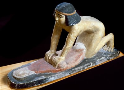 Egyptian antiquity: Egyptian crushing cereals to make bread. Figurine by Egyptian 5th Dynasty