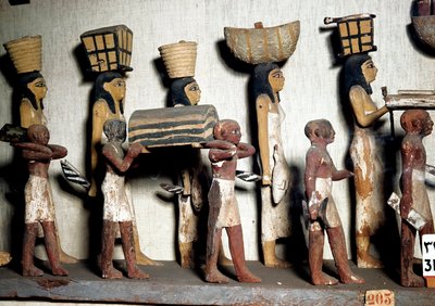 Egyptian Antiquity: A Sculpted Group of Painted Wood Representing Servants Bearing Offerings to the Deceased by Egyptian Egyptian
