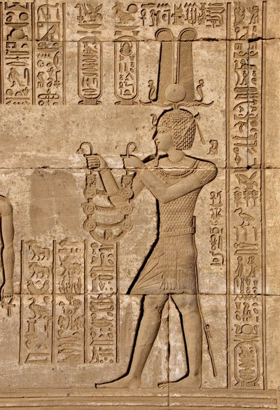 Roman mammisi commemorating the birth of Ihy, son of Isis - Detail of reliefs and hieroglyphs: Emperor Trajan carrying offerings to the goddess Hathor - Temple of Hathor, Denderah, Egypt by Egyptian Ptolemaic Period