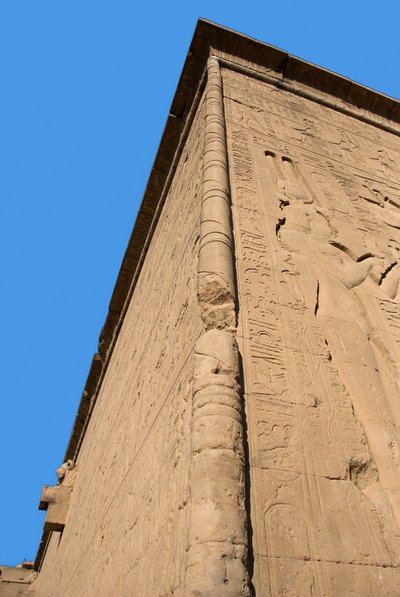 Egyptian antiquity: corner of the back wall of the temple dedicated to the goddess Hathor (on the right representation of Cleopatra). Denderah, Egypt by Egyptian Ptolemaic Period