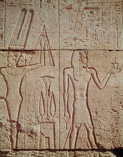 Relief Depicting Philip Arridaeus Holding a Censer Before Amun with the God Min on the Left by Egyptian Ptolemaic Period