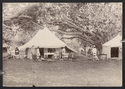 J.J. Cotton in topi and tent (b/w photo) by English Photographer