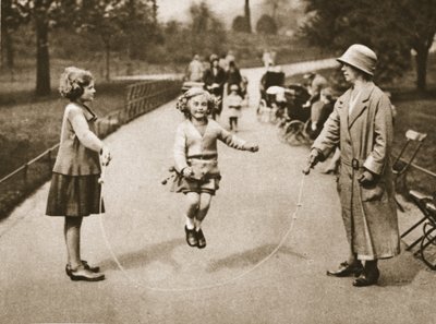 A girl skipping in Hyde Park or Kensington Gardens, from Wonderful London, published 1926-27 by English Photographer