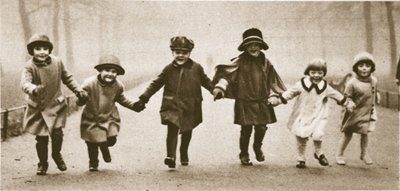 A line of well-dressed children running in Hyde Park, from Wonderful London, published 1926-27 by English Photographer