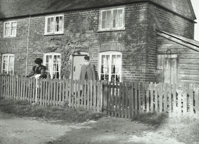 A Rural Scene in the Wandsworth Area with an Elderly Couple in the Garden of a Cottage-Style Property, London, 1895 by English Photographer
