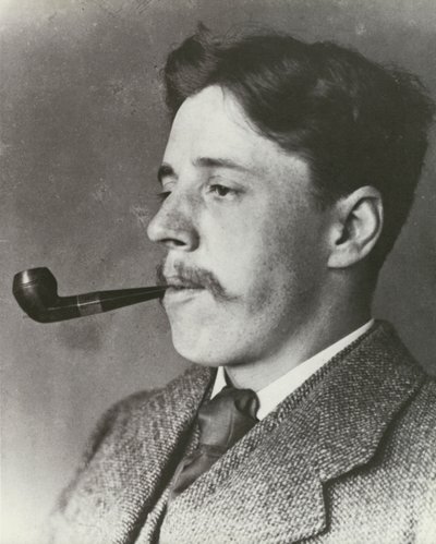 Arnold Bennett, smoking a pipe, portrait by English Photographer