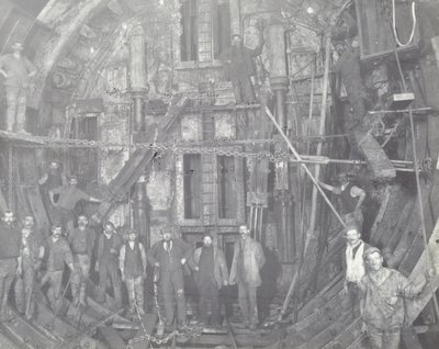 Blackwall Tunnel: A Group of Workers Stand in the Air Lock, 1894 by English Photographer