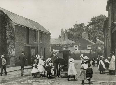 Crowd of Children Gather Around a Street Organ by English Photographer